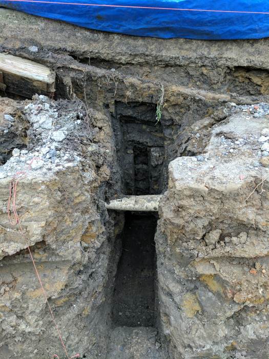 Excavated hole for permanent prop